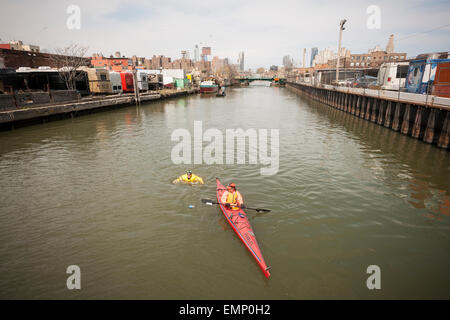 New York, USA. 22nd Apr, 2015. Donning his protective wetsuit, clean water activist Christopher Swain swims in the fetid waters of the polluted Gownus Canal in Brooklyn in New York on Earth Day, April 22, 2015. Swain's swim, swimming about a third of the canal, was to call attention for an accelerated cleanup of the waterway. The Gowanus Canal, which was completed in the late 1860's to facilitate industry along it's banks, became increasingly polluted until a pumping station was constructed at one end in the early 20th century to 'flush' out the canal. Credit:  Richard Levine/Alamy Live News Stock Photo