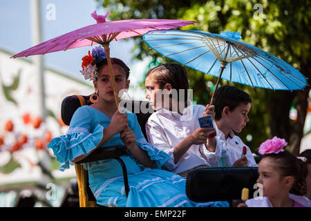 Seville, Andalucia, Spain. 22nd Apr, 2015. Children ride in chariot at the 'Feria de Abril' (April's Fair), Seville, Spain, 22 april, 2015. Credit:  Daniel González Acuña/Alamy Live News Stock Photo