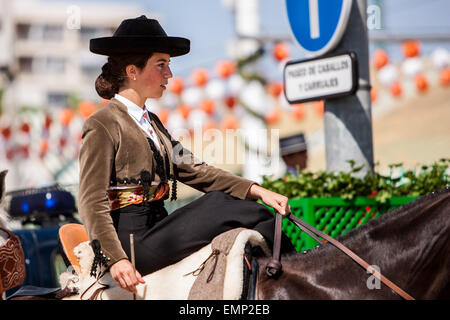 Seville, Andalucia, Spain. 22nd Apr, 2015. A horsewoman rides at the 'Feria de Abril' (April's Fair), Seville, Spain, 22 april, 2015. Credit:  Daniel González Acuña/Alamy Live News Stock Photo