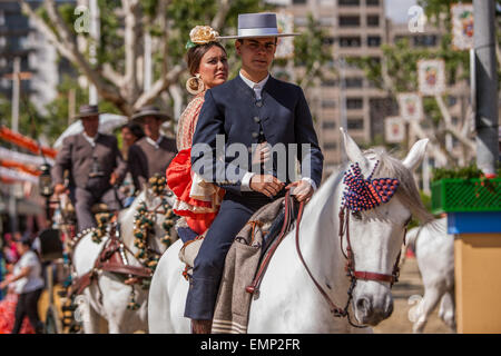 Seville, Andalucia, Spain. 22nd Apr, 2015. A horsewoman and a horseman ride at the 'Feria de Abril' (April's Fair), Seville, Spain, 22 april, 2015. Credit:  Daniel González Acuña/Alamy Live News Stock Photo