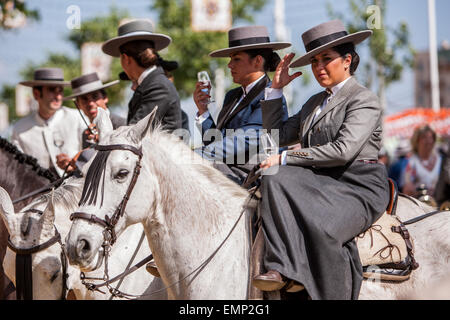 Seville, Andalucia, Spain. 22nd Apr, 2015. A group of horsewomen drink at the 'Feria de Abril' (April's Fair), Seville, Spain, 22 april, 2015. Credit:  Daniel González Acuña/Alamy Live News Stock Photo