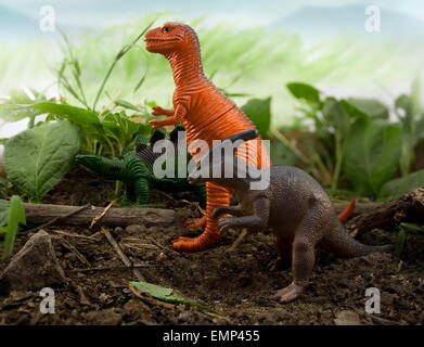 Jungle Dinosaur in line. Dinosaurs stegosaurus, tyrannosaur & parasaurolophus standing on nature and leaf background. Stock Photo