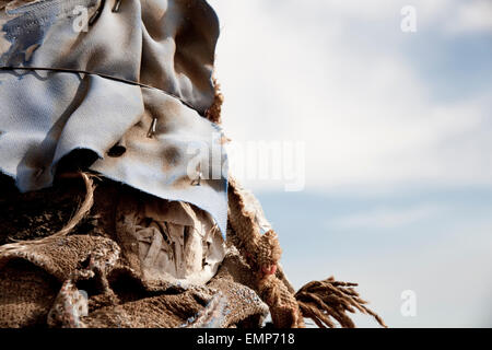 Detail of a pole in the desert near Joshua Tree, California, wrapped in torn and textured fabric. Stock Photo