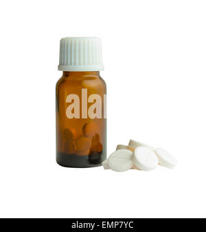 Small bottle from brown glass closed by a cover. Handful of tablets. Stock Photo