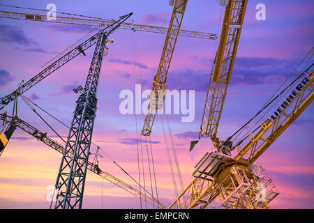 Cranes at Bauma 2013 in evening light, international trade fair for construction machinery, Munich, Bavaria, Germany Stock Photo