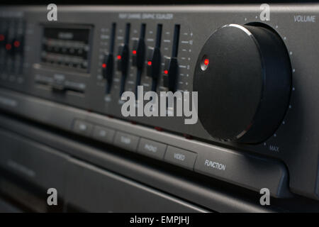 Volume and graphic equalizer controls on an audio system shot with low key selective shallow focus Stock Photo