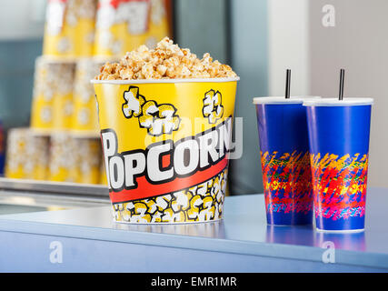 Popcorn Bucket With Drinks On Concession Counter Stock Photo