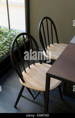 Interior of a contemporary restaurant/bar, two chairs and a table, close up Stock Photo