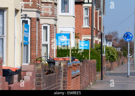 Conservative Political Party posters of support outside row of houses in marginal constituency of Bedford, Bedfordshire, England Stock Photo