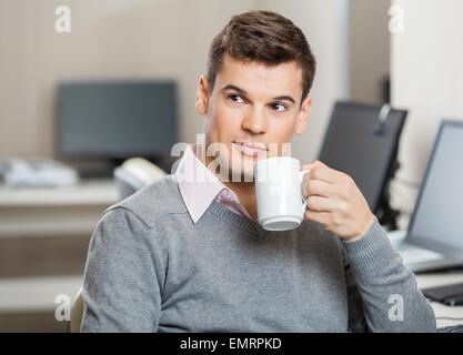 Employee Having Coffee In Call Center Stock Photo