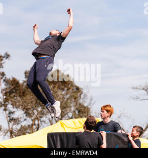 A Free runner demonstrating Parkour at Framlingham Country Show in Framlingham , Suffolk , England , Britain , Uk Stock Photo