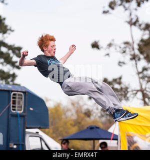 A Free runner demonstrating Parkour at Framlingham Country Show in Framlingham , Suffolk , England , Britain , Uk Stock Photo