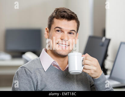 Smiling Employee Having Coffee In Call Center Stock Photo