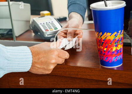Women Buying Movie Tickets At Box Office Stock Photo