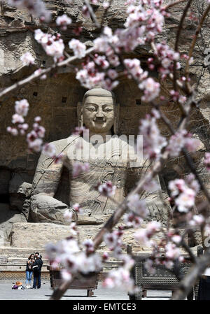 Datong, China's Shanxi Province. 22nd Apr, 2015. Tourists visit the Yungang Grottoes in Datong, north China's Shanxi Province, April 22, 2015. The Yungang Grottoes, listed as a UNESCO World Cultural Heritage site in 2001, will witness a tourism peak as the May Day holiday is coming. Credit:  Yan Yan/Xinhua/Alamy Live News Stock Photo