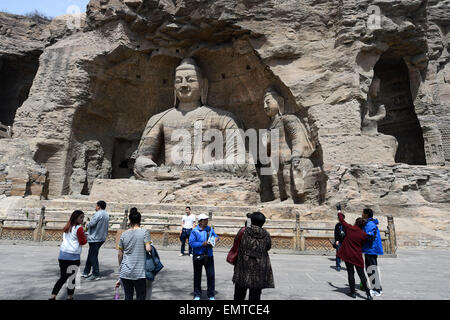 Datong, China's Shanxi Province. 22nd Apr, 2015. Tourists visit the Yungang Grottoes in Datong, north China's Shanxi Province, April 22, 2015. The Yungang Grottoes, listed as a UNESCO World Cultural Heritage site in 2001, will witness a tourism peak as the May Day holiday is coming. Credit:  Yan Yan/Xinhua/Alamy Live News Stock Photo