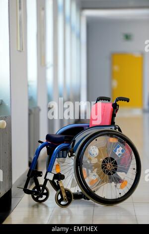 Wheelchair standing in an aisle./picture alliance Stock Photo