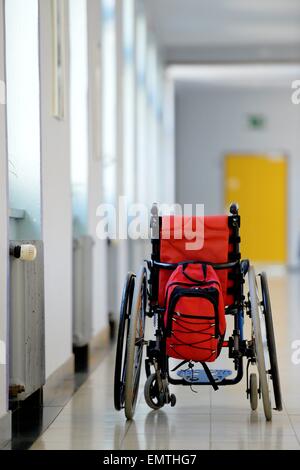 Wheelchair standing in an aisle./picture alliance Stock Photo