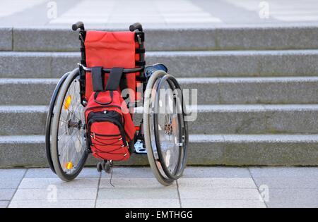 Wheelchair infront of steps./picture alliance Stock Photo