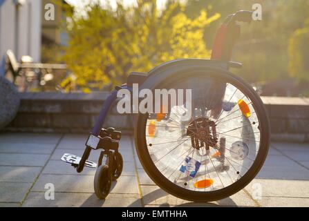 Wheelchair in the sun./picture alliance Stock Photo