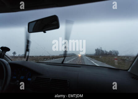 Bad weather conditions driving a car, wipers working Stock Photo