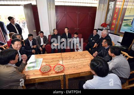 Nanyang, China's Henan Province. 22nd Apr, 2015. Chinese Vice Premier Zhang Gaoli talks with villagers of Jiuchong Town, central China's Henan Province, April 22, 2015. Zhang made an inspection tour of the south-to-north water diversion project in Henan from April 22 to 23. © Li Tao/Xinhua/Alamy Live News Stock Photo