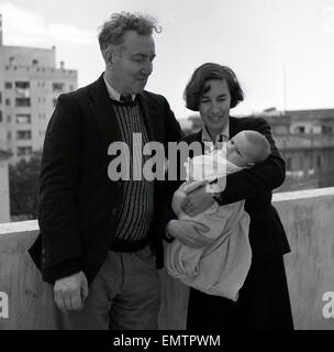 1953, historical picture of English author, novelist, critic, translator and classicist poet, Robert Graves, with his second wife Beryl and their baby boy Tomas, Majorca. Stock Photo