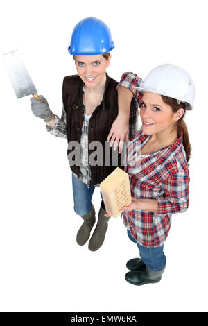 Two female bricklayers Stock Photo