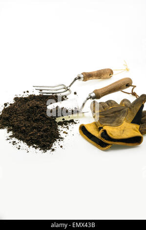 garden tools and soil, isolated on a white background. Stock Photo