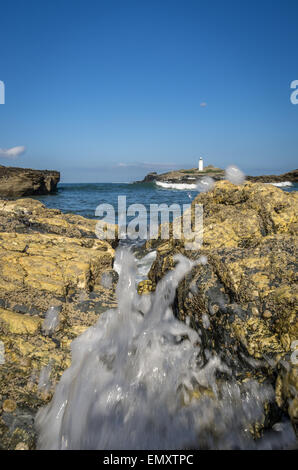 Waves crashing in at Godrevy lighthouse in cornwall england uk Stock Photo