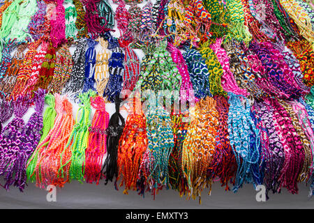 Brightly colored jewelry on display at Otavalo market, Ecuador Stock Photo