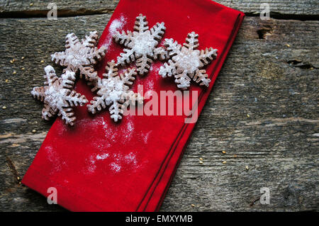 Christmas cookies snow flake shaped on a wooden background Stock Photo