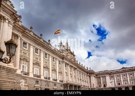 Royal Palace Palacio Real Clouds Sky Cityscape Spanish Flag Madrid Spain.  Phillip 5 reconstructed palace in the 1700s. Stock Photo