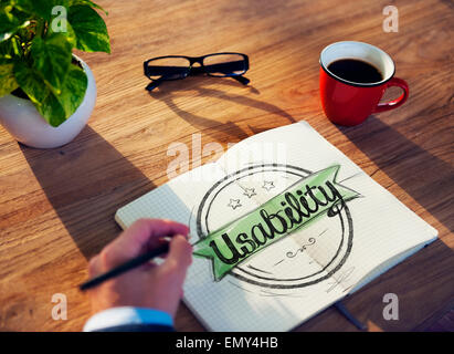 Man with Note Pad and Usability Concept Stock Photo