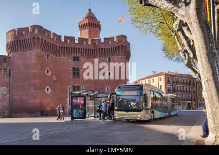 People getting on bus to Languedoc outside the Porte du Notre Dame, Perpignan, Languedoc-Roussillon,Pyrenees-Orientales, France Stock Photo