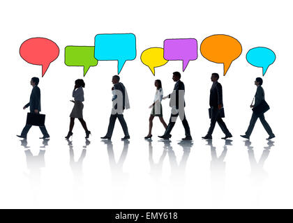 Silhouettes of Business People and Speech Bubbles Stock Photo