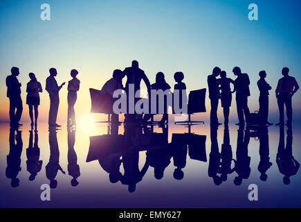 Silhouettes of Diverse Business People with Different Activities Stock Photo