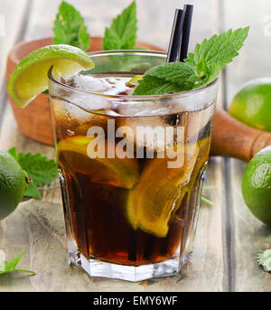 Alcoholic cocktail with rum, lime,  mint  and ice. Selective focus Stock Photo