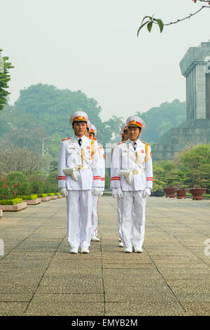 HANOI, VIETNAM - January 27, 2014: Guards on parade at the Ho Chi Minh Mausoleum in Ba Dinh Square in Jaunary 2014. Stock Photo