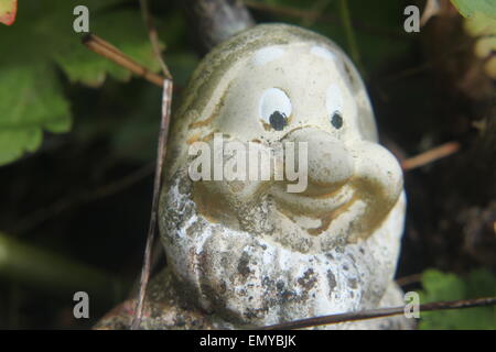 smiling garden gnome in summer Stock Photo