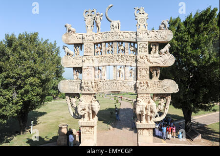 Sanchi, india - 1 february 2015: People looking at the details of Carved decoration of the Northern gateway to the Great Stupa o Stock Photo