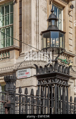 A portrait image of the gated entrance to Downing Street, office to the Prime Minister of England,  London England UK Stock Photo