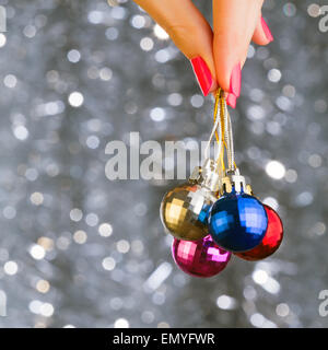 Ð¡hristmas disco balls on beautiful grey bokeh background. Woman Stock Photo