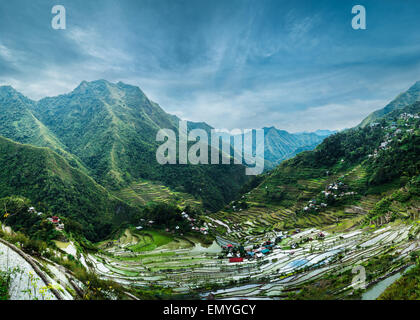 Amazing panorama view of rice terraces fields in Ifugao province mountains under cloudy blue sky. Banaue, Philippines UNESCO her Stock Photo