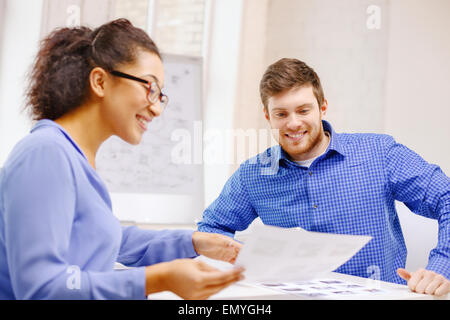 smiling team with paper at office Stock Photo