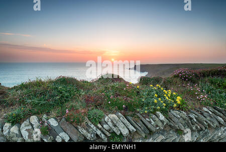 Sunset from the South West Coast Path at Park Head near Porthcothan on the north Cornwall coast Stock Photo