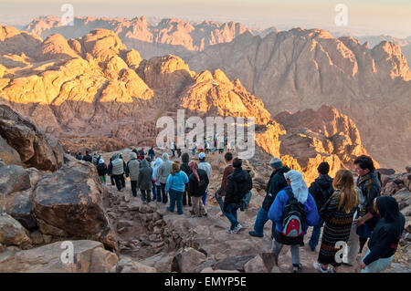 Pilgrims and tourists on the pathway from the Mount Sinai peak and panorama rocks of Mount Sinai Stock Photo