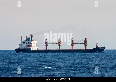 General cargo ship Tykoon II sails along the shore of the Red Sea near Sharm El Sheih Stock Photo