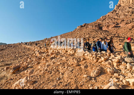 Pilgrims descend from Mount Sinai after meeting the sunrise Stock Photo