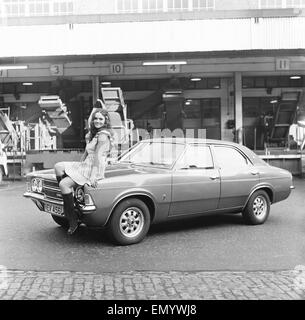 Reveille model Barbara seen here posing with a Ford car which is a top prize in the Reveille win a car competition circa 1972 Stock Photo